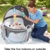 Fisher-Price Portable Bassinet and Play Space On-The-Go Baby Dome with Developmental Toys and Canopy, Windmill - Image 3