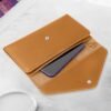 DTTO Passport Holder Travel Wallet for Women, Multi-purpose PU Leather Waterproof Passport Cover with Wrist Strap for Passport, Cards, Boarding Passes, Keys, Brown - Image 4