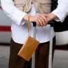 DTTO Passport Holder Travel Wallet for Women, Multi-purpose PU Leather Waterproof Passport Cover with Wrist Strap for Passport, Cards, Boarding Passes, Keys, Brown - Image 5
